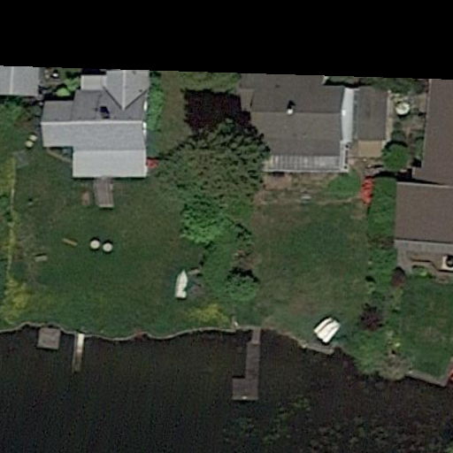 Remote-sensing image with a grounded ship near the grassy shore